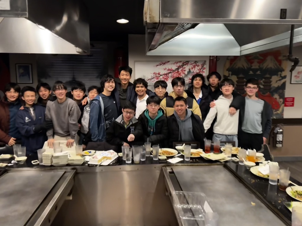 Konnor with classmates at a hibachi dinner